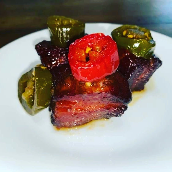 smoked candied jalapeños on pork belly